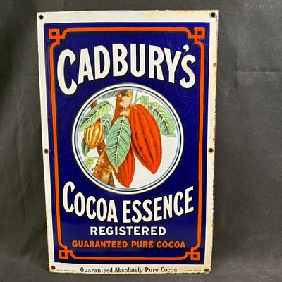 Cadbury's Enamel Advertising Sign. Deep blue ground with central cocoa pod vignette. Orange 
