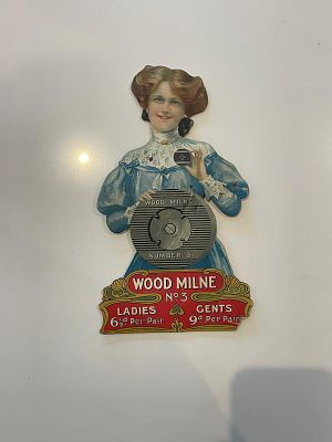 Wood-Milne Rubber Heels Advertising Showcard. Die-cut silhouette of an Edwardian woman holding a 