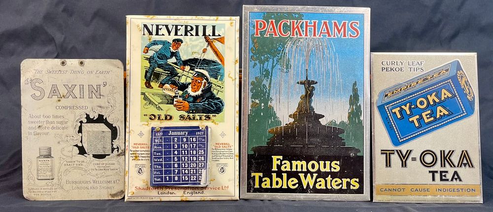 Lot 162: Various small tin advertising signs some with built in stands (Measurements: 14cm W Ã— 22 cm H) 1927