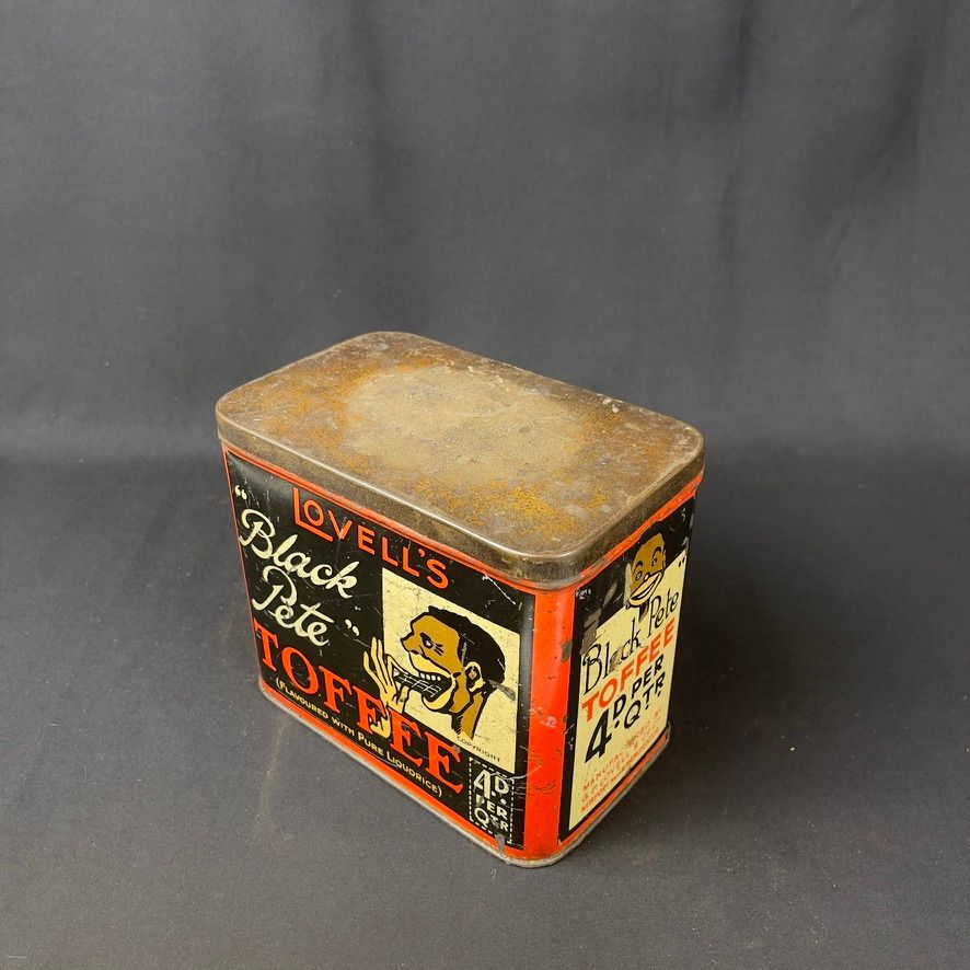 Lot 179: Smaller “Black Pete” Lovell’s Toffee Tin