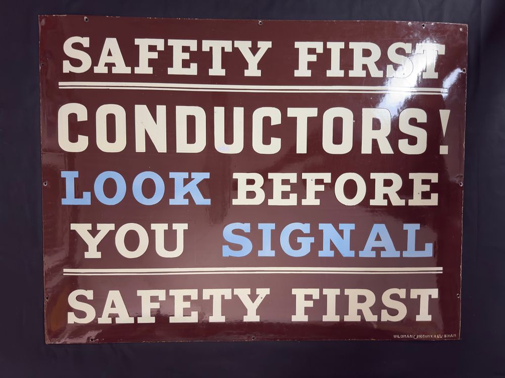 Lot 212: SAFETY FIRST CONDUCTORS! LOOK BEFORE YOU SIGNAL enamel sign