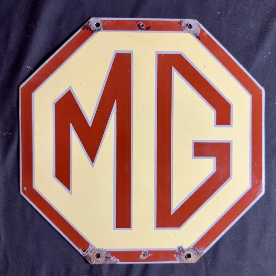Lot 151: An MG enamel sign
