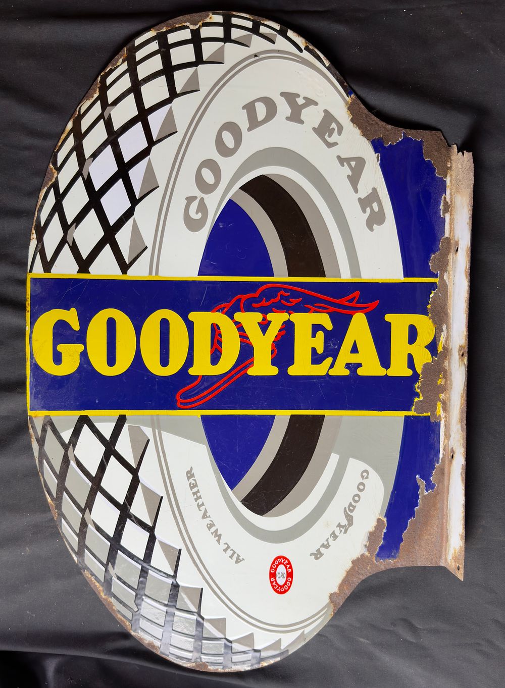 Lot 155: A Goodyear flanged enamel sign