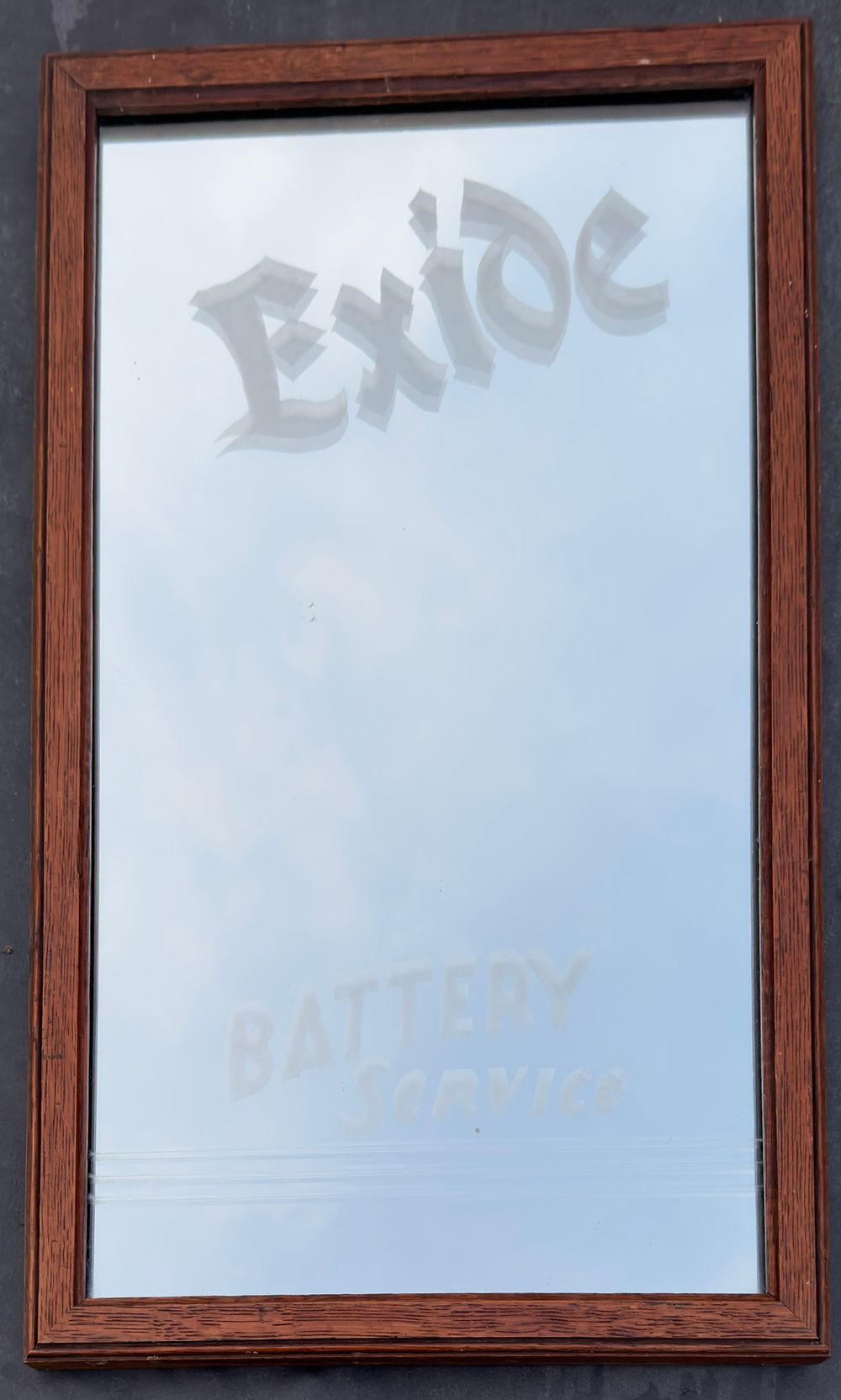 Lot 187: An Exide battery advertising mirror