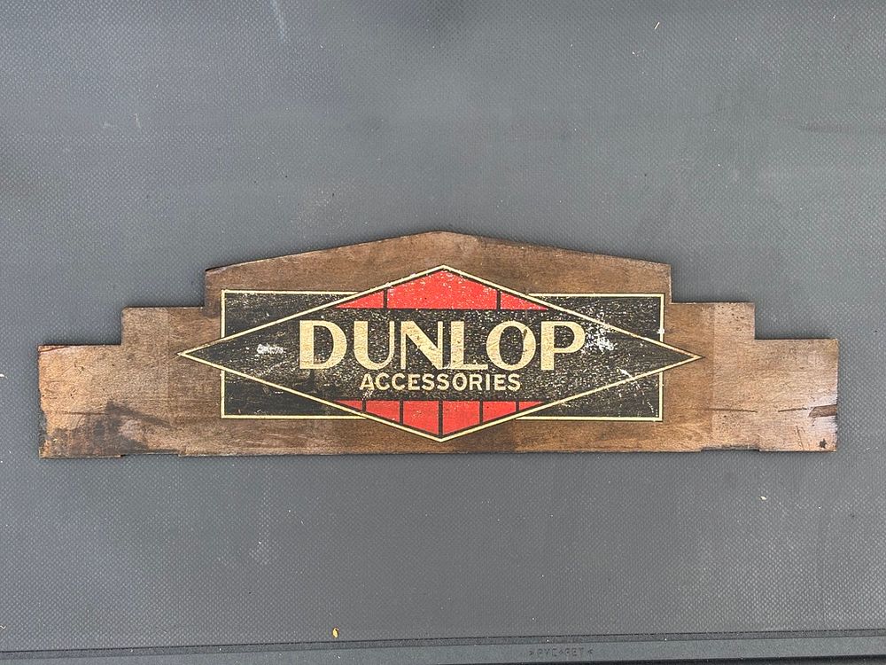 Lot 251: A Dunlop Accessories Cabinet Pediment Unusual double-sided laminated...
