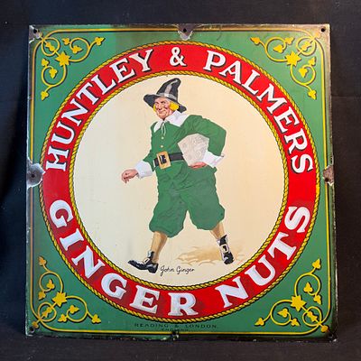 Huntley & Palmers Ginger Nuts Enamel Advertising Sign. Green field with mascot graphic and red 