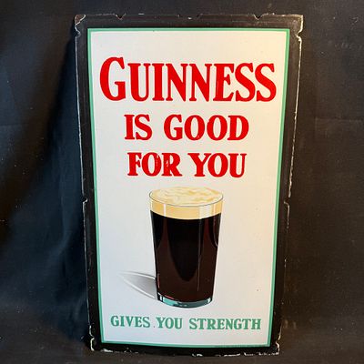 Guinness Enamel Advertising Sign. White background with red and green block lettering. Features 