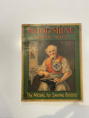 Wood-Milne Lithographed Cardboard Advertising Showcard. Illustration of an elderly cobbler in 