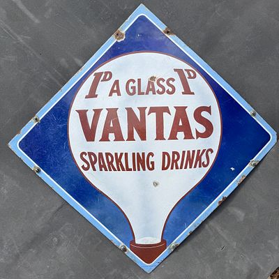 Vantas Enamel Advertising Sign. Diamond-shaped with cobalt blue background and soda fountain 