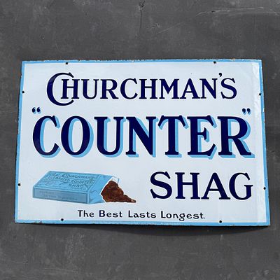 Churchman's Enamel Advertising Sign. White background with multi-toned blue typography. Features 