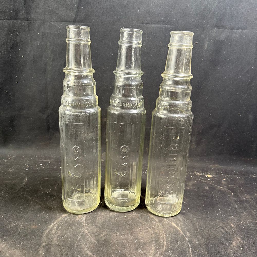 Lot 304: Esso and Essolube One Pint Glass Motor Oil Bottles Clear Glass