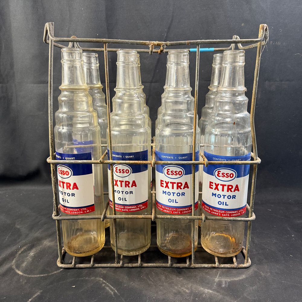 Lot 323: Esso Motor Oil Bottle Set in Wire Carrier Glass and Steel