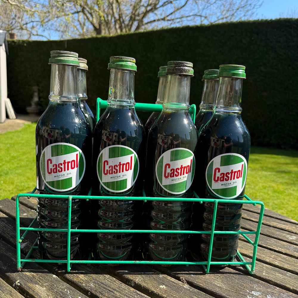 Lot 156: A Set of Eight Castrol Motor Oil Bottles and Carrier