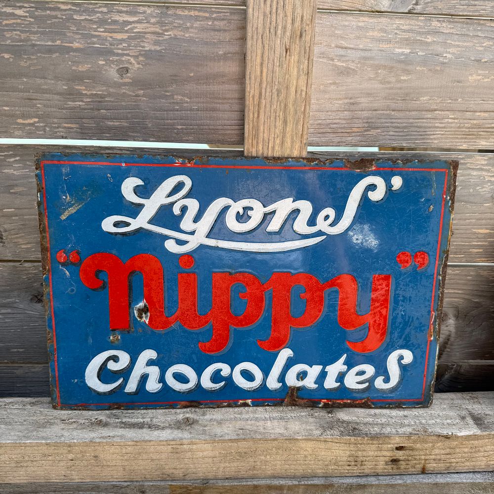 Lot 505: Lyons Nippy Chocolates Flanged Enamel Advertising Sign