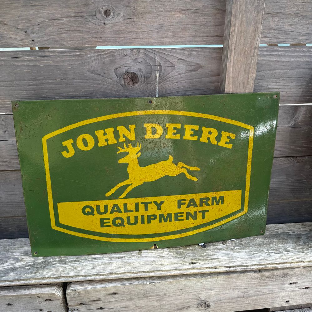 Lot 577: John Deere Quality Farm Equipment Enamel Advertising Sign, reproduction