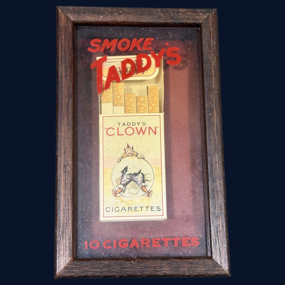 Lot 104: A Framed Taddy's Clown Cigarettes Advertisement