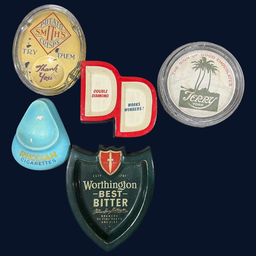 Lot 182: A Collection of Pub and Retail Advertising Counter-Top Change Trays