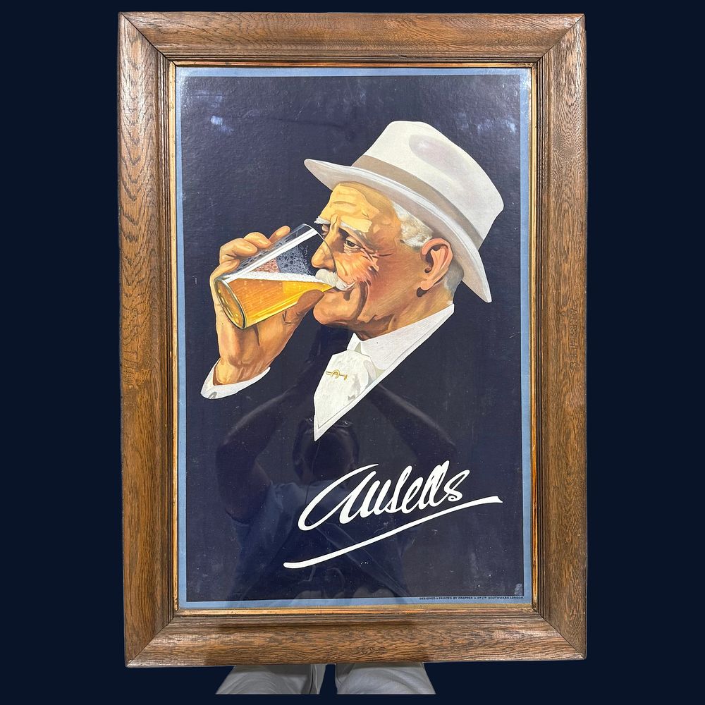 Lot 219: Ansells Ale Advertising Poster in Branded Oak Frame