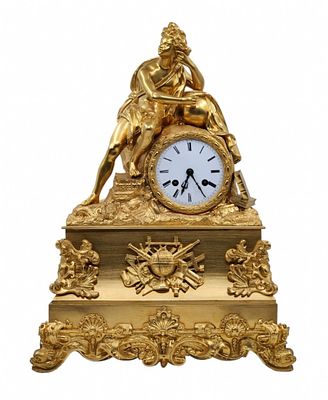 An antique French mantle clock. Made of gilded bronze (Ormolu - or dore bronze). decorated with 
