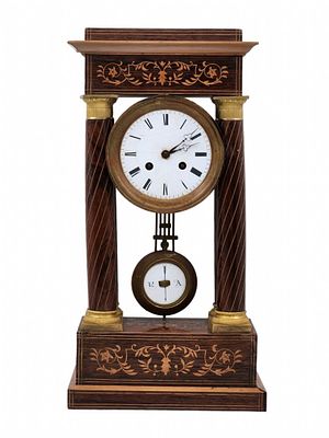 Antique French 'Portico' clock from the 19th century. 'Empire style' period made of wood, gilded 