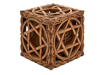 Table ornament designed as a puzzle box, hand-carved in wood. Exterior sawed with Star of David 