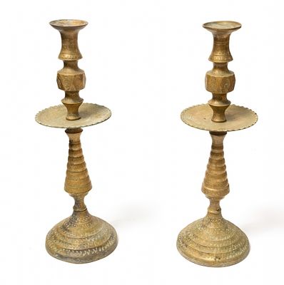 Pair of antique Moroccan candlesticks, made of cast brass. Decorated with delicate hand 