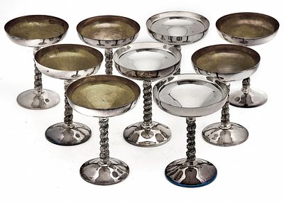 9 Silver-Plated Metal Champagne Glasses, Stamped. Goblet height: 14 cm. 
Rim diameter: 11 cm