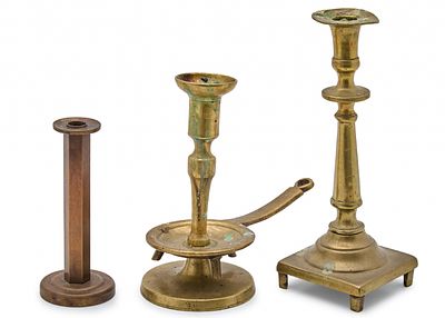 A Lot of Three Antique Bronze Candlesticks, the Two Larger Dating from the 18th Century. The 