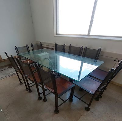 אילנה גור - שולחן וכסאות . שולחן זכוכית + 10 כסאות מברזל מעוצבים .+שולחן אוכן . פריט מוזאוני . 