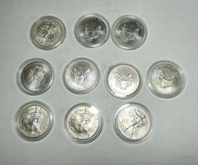 לוט 10 מטבעות כסף של 1 דולר WALKING MAN שנת 2011 , קוטר39 , משקל כל מטבע 31.25 
