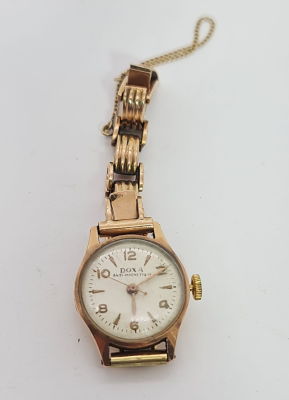 שעון DOXA זהב 14 קראט , לא נראה עובד , משקל כולל 21 גרם , גם הרצועה מזהב