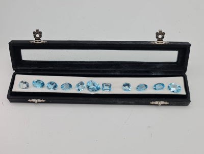 לוט 11 אבני בלו טופז מלוטשות סופר AAA++, משקל 65 קראט, צבע נהדר, מופיעות בקופסת 