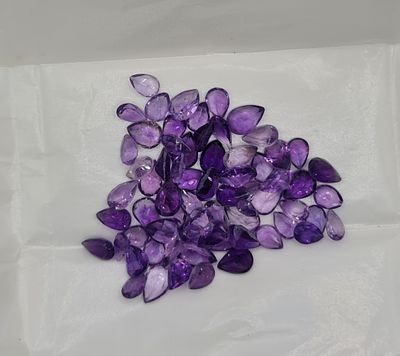 לוט אבני אמטיסט מלוטשות סופר AAA+++, משקל 50 קראט, מגיעות בבריפקה עם תג מחיר של 6$ 