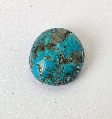 אבן טורקיז אפגניסטן מלוטשת וגדולה, משקל 52.47 קראט, נדירה, הוצאה מבריפקה עם תג מחיר 