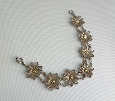 Изысканный серебряный браслет в сложной художественной технике объемной филиграни (скани). 