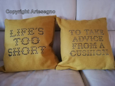Banksy (1974) - Single lot consisting of 2 cushions, car paint (Stencil) 
cm 40x40 cad. 
2019 
