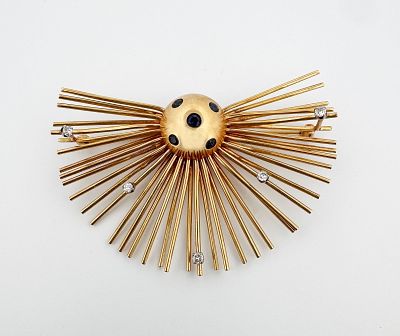 14k Diamond & Sapphire Sunburst Brooch. 14k yellow gold diamond and sapphire brooch 
22.9g 
68mm wide