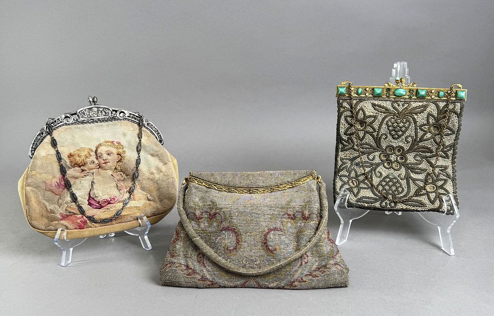 Three Vintage Evening Bags. Including a sterling silver fabric cross-stich purse, a metal dore 