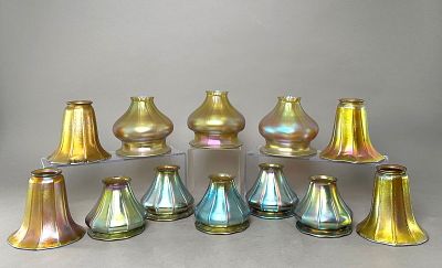 Twelve Iridescent Glass Lamp Shades. Ten iridescent glass lamp shades in varying shapes and 