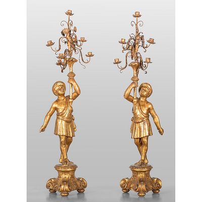 Coppia di candelieri in legno dorato raffiguranti - Coppia di candelieri in legno dorato 