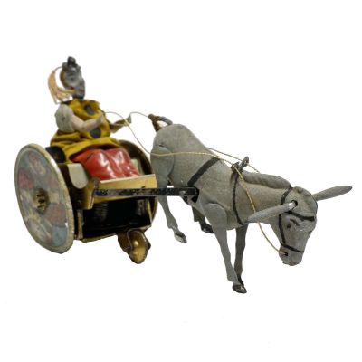 Lehmann Balky Mule Automaton Circa 1905. Tin toy of a clown sitting on a cart and steering a 
