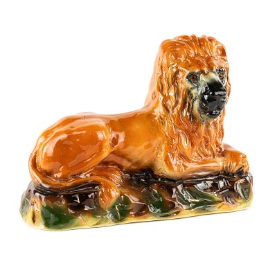 Staffordshire Ceramic Recumbent Lion Figurine. A Staffordshire ceramic Recumbent Lion figurine 