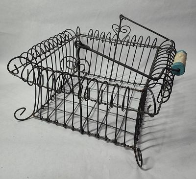 Footed Iron Basket. Wire basket with curled sides and a blue painted handle. 12x12x6
