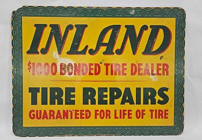 Inland Rubber Tire Sign. Composite sign. Several small dents and faded spots. Upper left hand