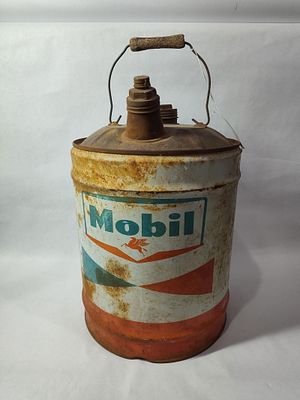 Mobil Oil 5 Gallon Can. One side shows some fading, surface rusting throughout but can is solid.