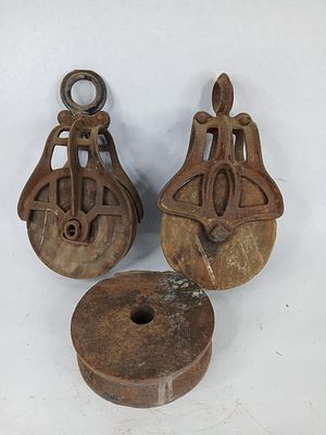 Cast and wooden barn pulleys. puppies are 6 in in dia.