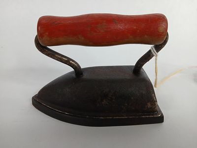 Lady Dover miniature sad iron w/wooden handle. made in Dover Ohio in the 1920th