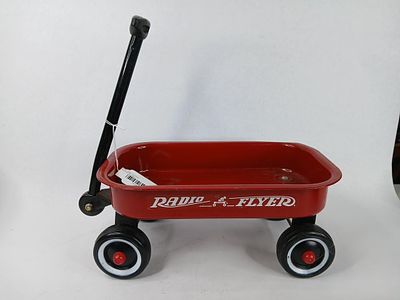 Radio Flyer small red wagon. wagon is 13 in long one wheel is wobbly but displays well