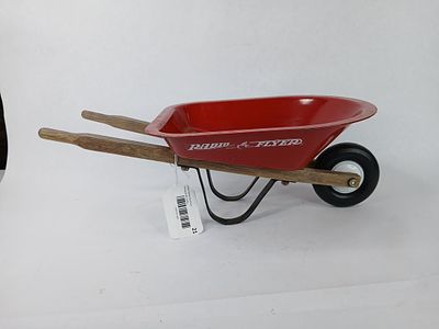 Radio Flyer small red wheelbarrow. wheelbarrow is 16 in long paint is chipping on inside