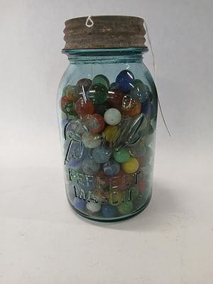 Blue glass Ball jar with marbles. .
